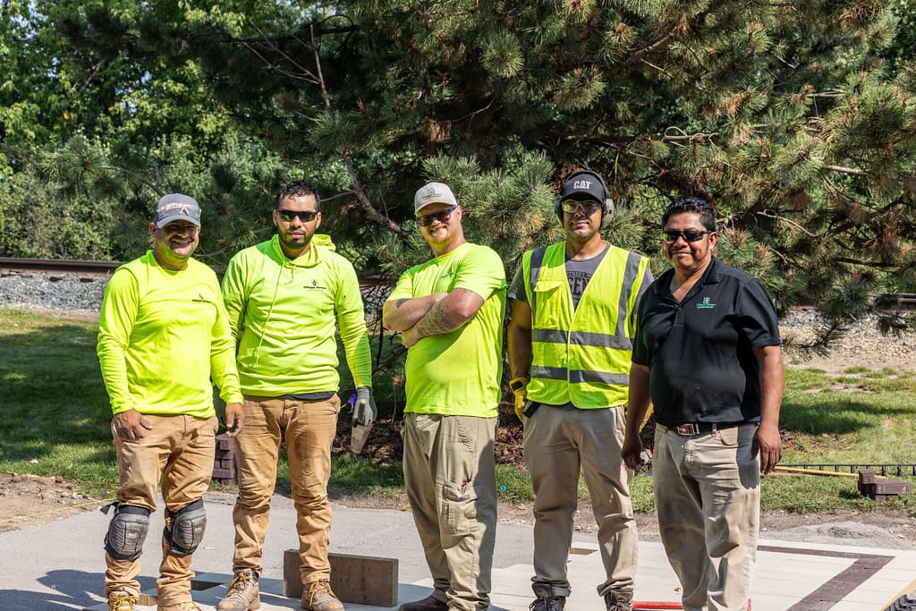 Village Green Landscapes team members outdoors