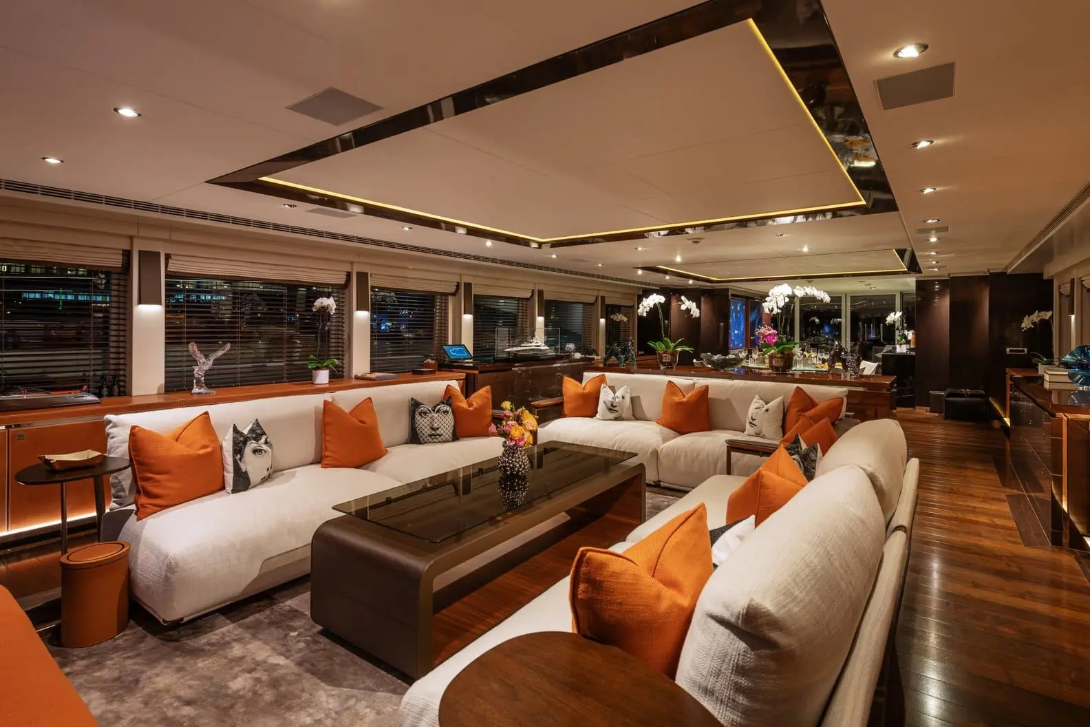 Heesen 5000 main saloon with cream sofas and orange accents