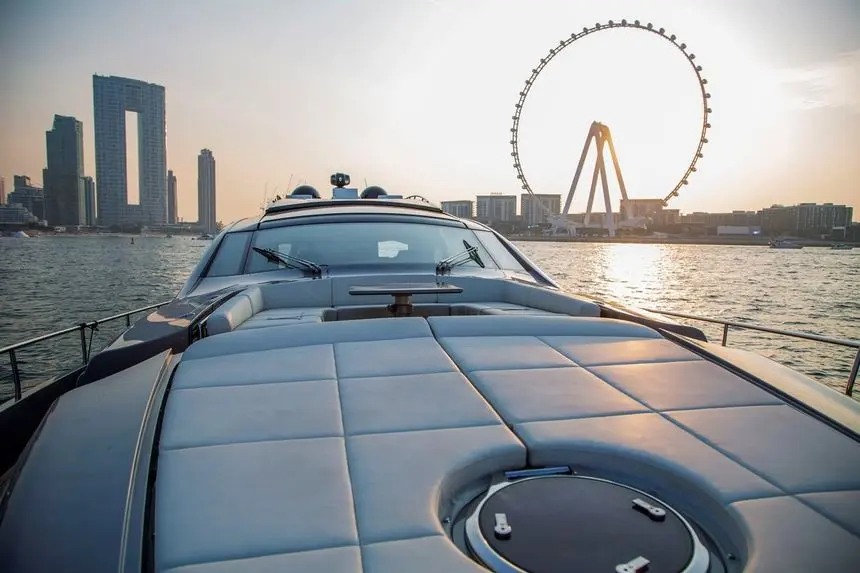 Pershing 82 foredeck sunpads with Ain Dubai on the horizon
