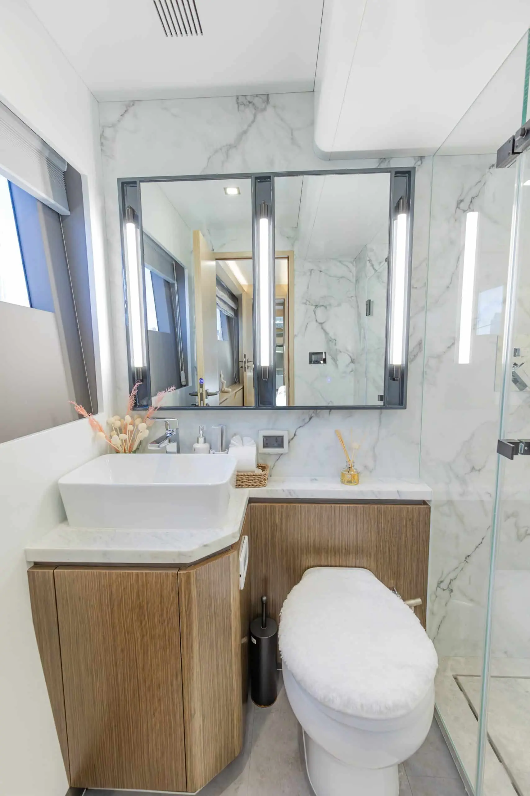 Zirve 72 luxury yacht bathroom with glass shower enclosure and wooden vanity