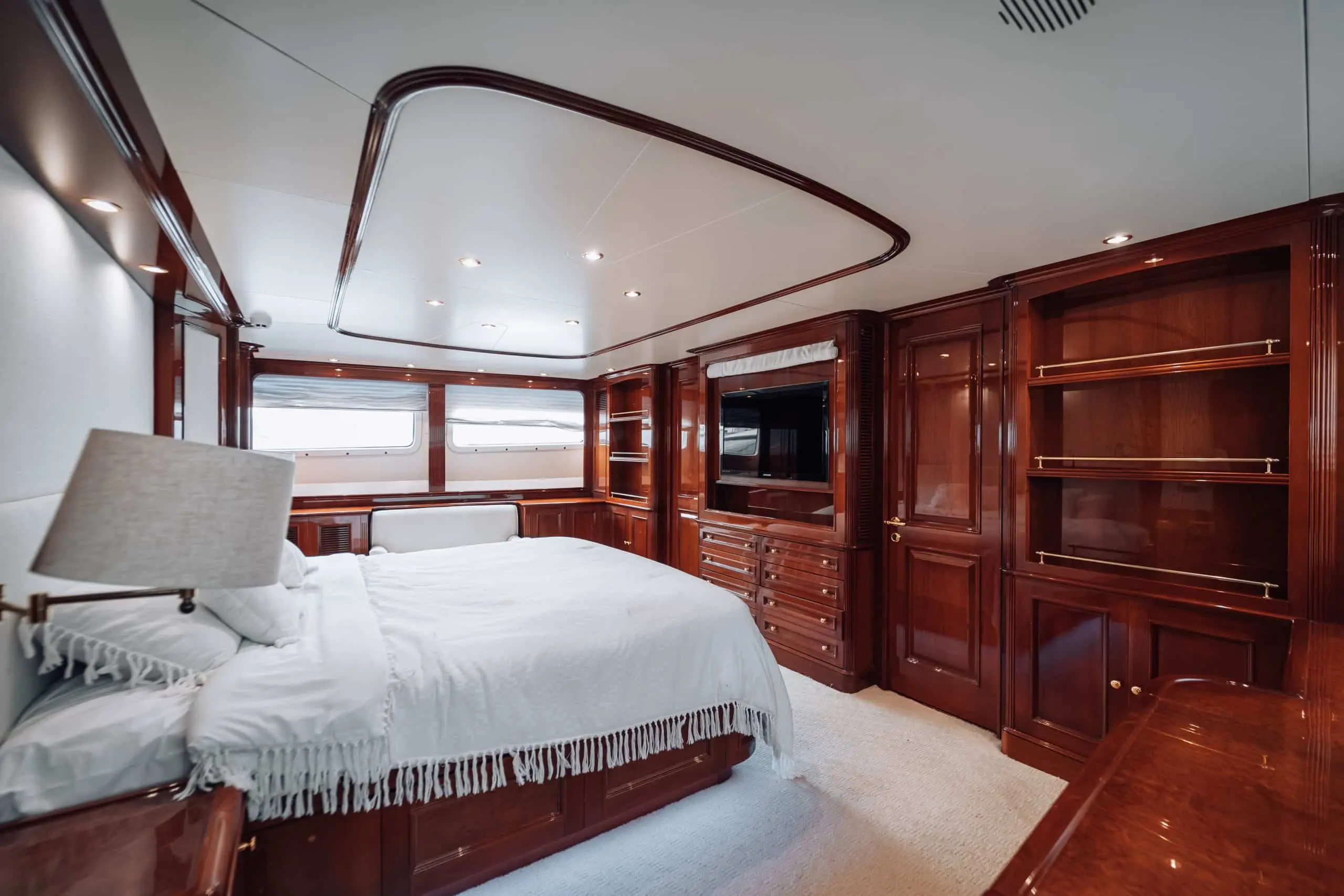 Royal Mirage yacht guest bedroom with panoramic windows and king bed