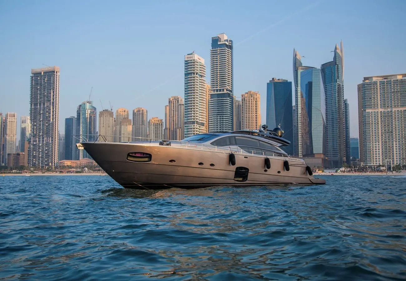 Pershing 82 bow quarter view with the JBR towers astern