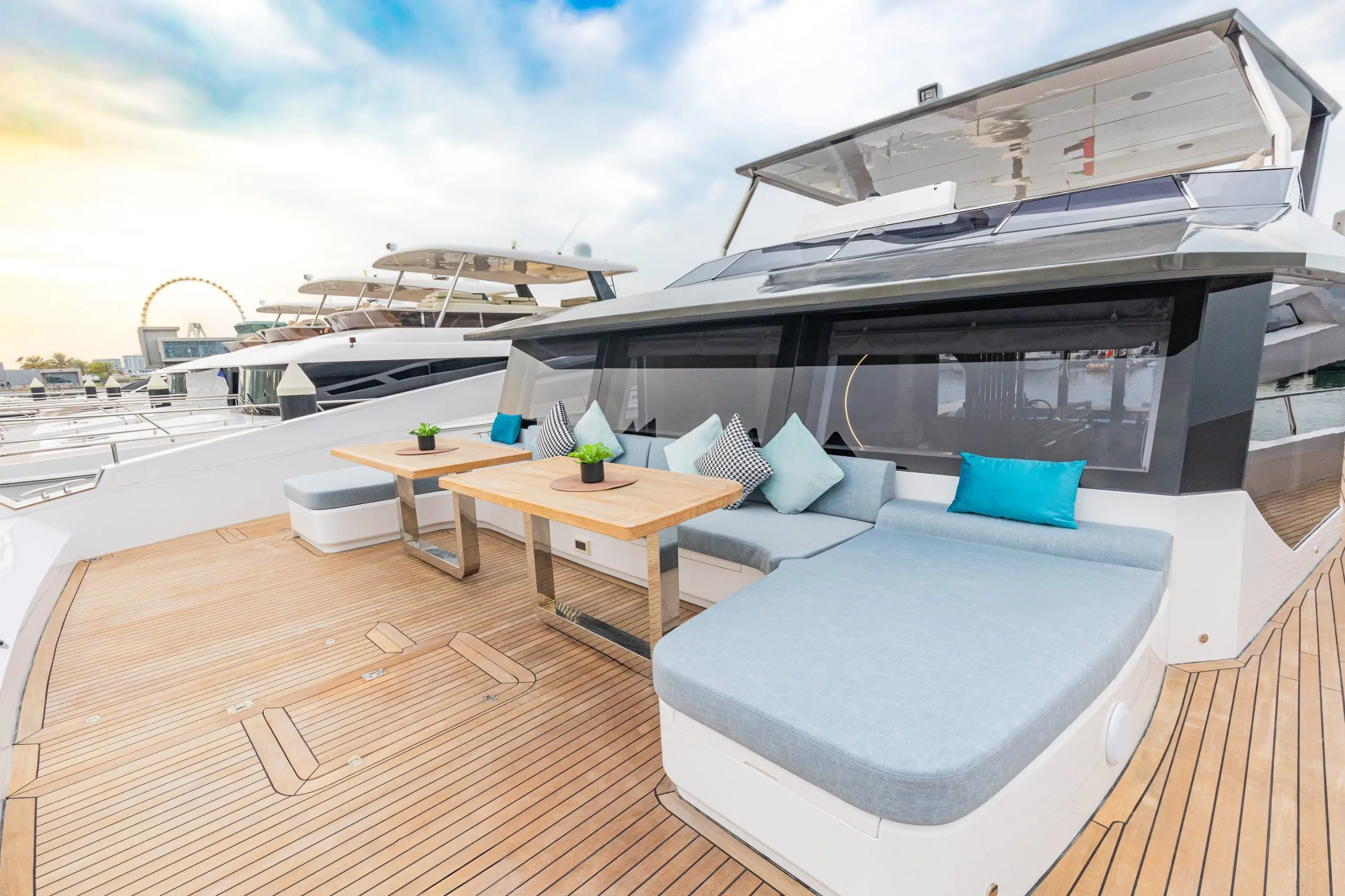 Zirve 72 yacht outdoor lounge with cushioned sunbeds and wooden deck