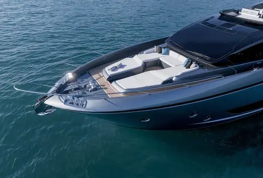 Riva 82 yacht bow sunbathing area with cushioned seating