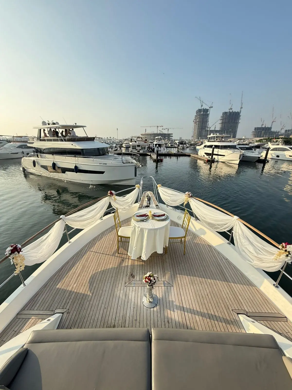 Zenith 64 yacht cruising near Dubai Marina skyline