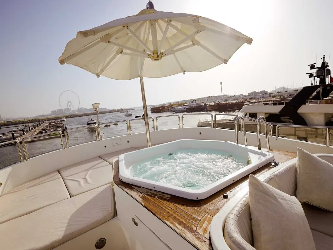 Royal Mirage yacht sun deck jacuzzi with ocean views and luxury seating area