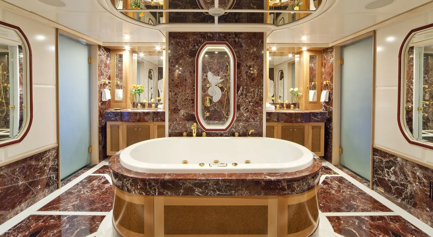 Athena 170 yacht spa room with massage table and ornate interior