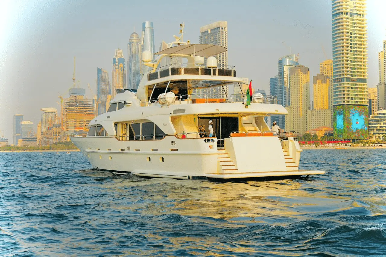 Benetti 120 luxury yacht exterior side view cruising on open sea during sunset