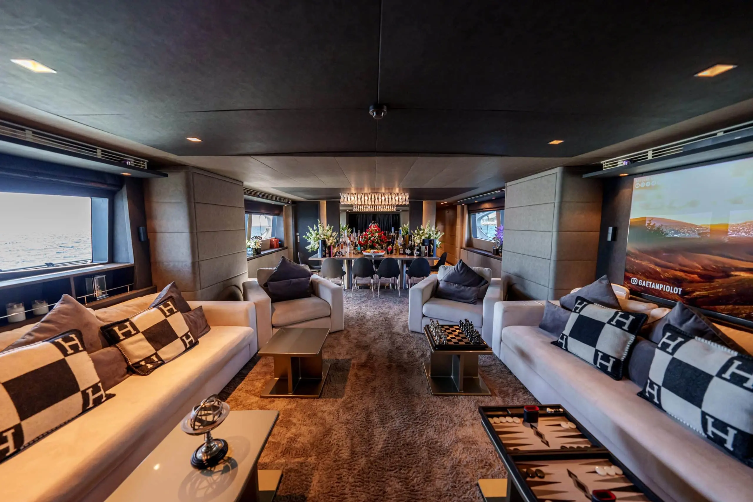 Spacious main saloon seating area on Tatti 110 luxury yacht
