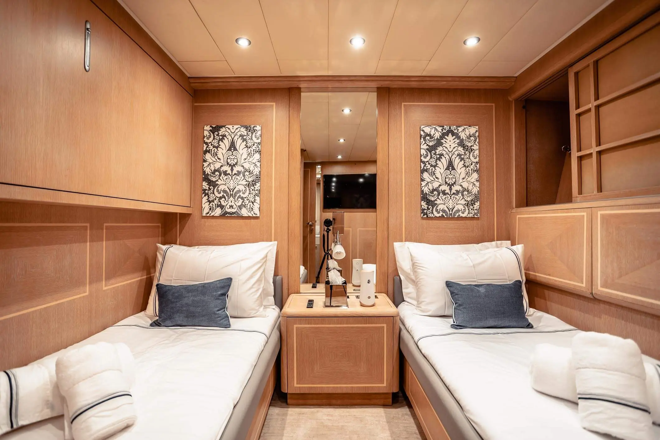 Baglietto 105 HT twin guest cabin with warm oak panelling