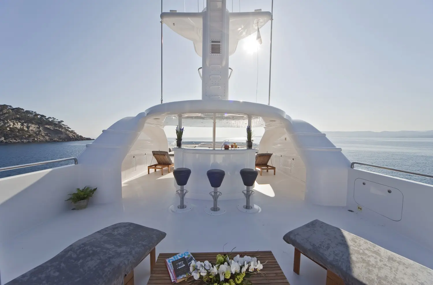 Athena 170 yacht master suite with large windows and ocean views