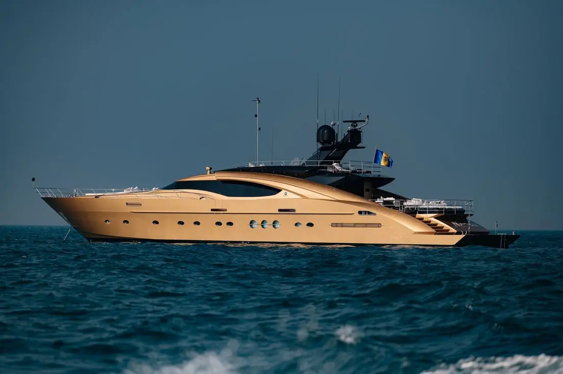Side view of Royalty 136 luxury yacht sailing on open sea