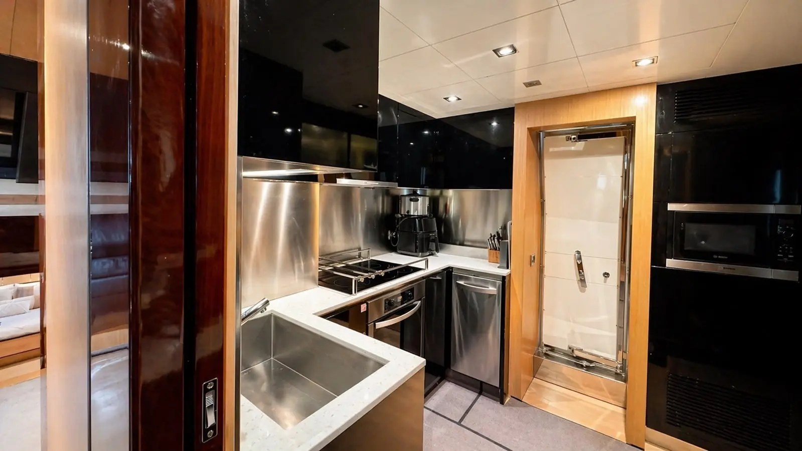 Azimut 88 galley with stainless steel appliances and hob