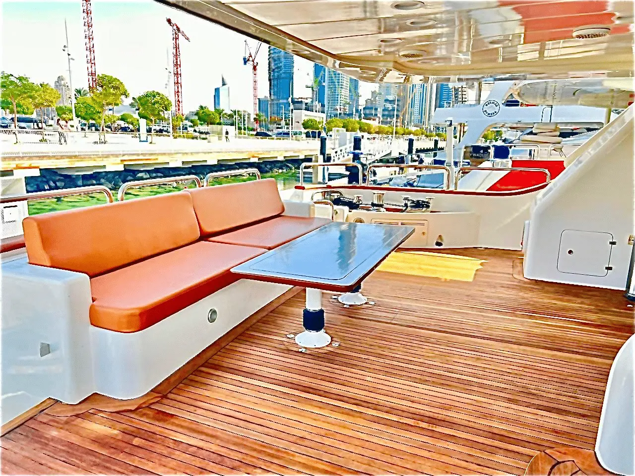 Benetti 120 outdoor lounge seating area with modern furniture and wooden deck