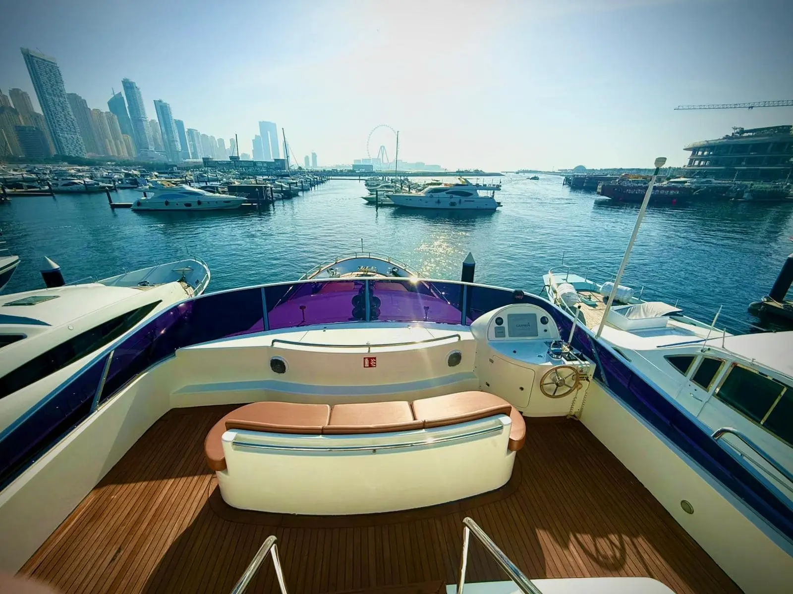 Benetti 120 aft deck jacuzzi with marina and city skyline view