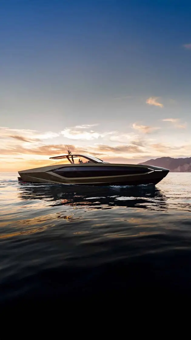 Tecnomar Lamborghini 63 bow-on profile at dusk, shipyard photo