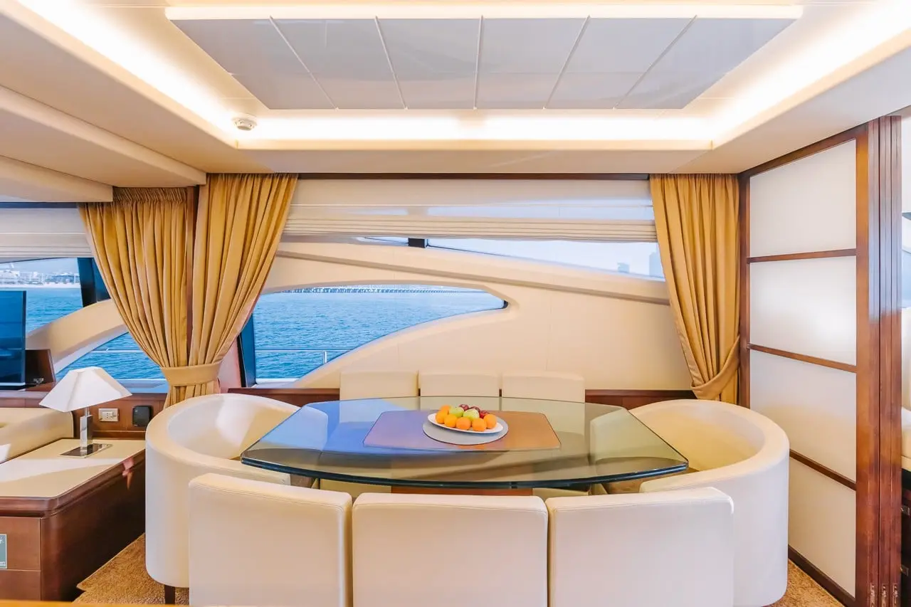 Formal dining table setup inside Azimut 79 private yacht charter