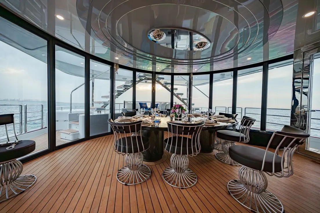 Thunder Superyacht upper deck dining area with panoramic Dubai skyline views