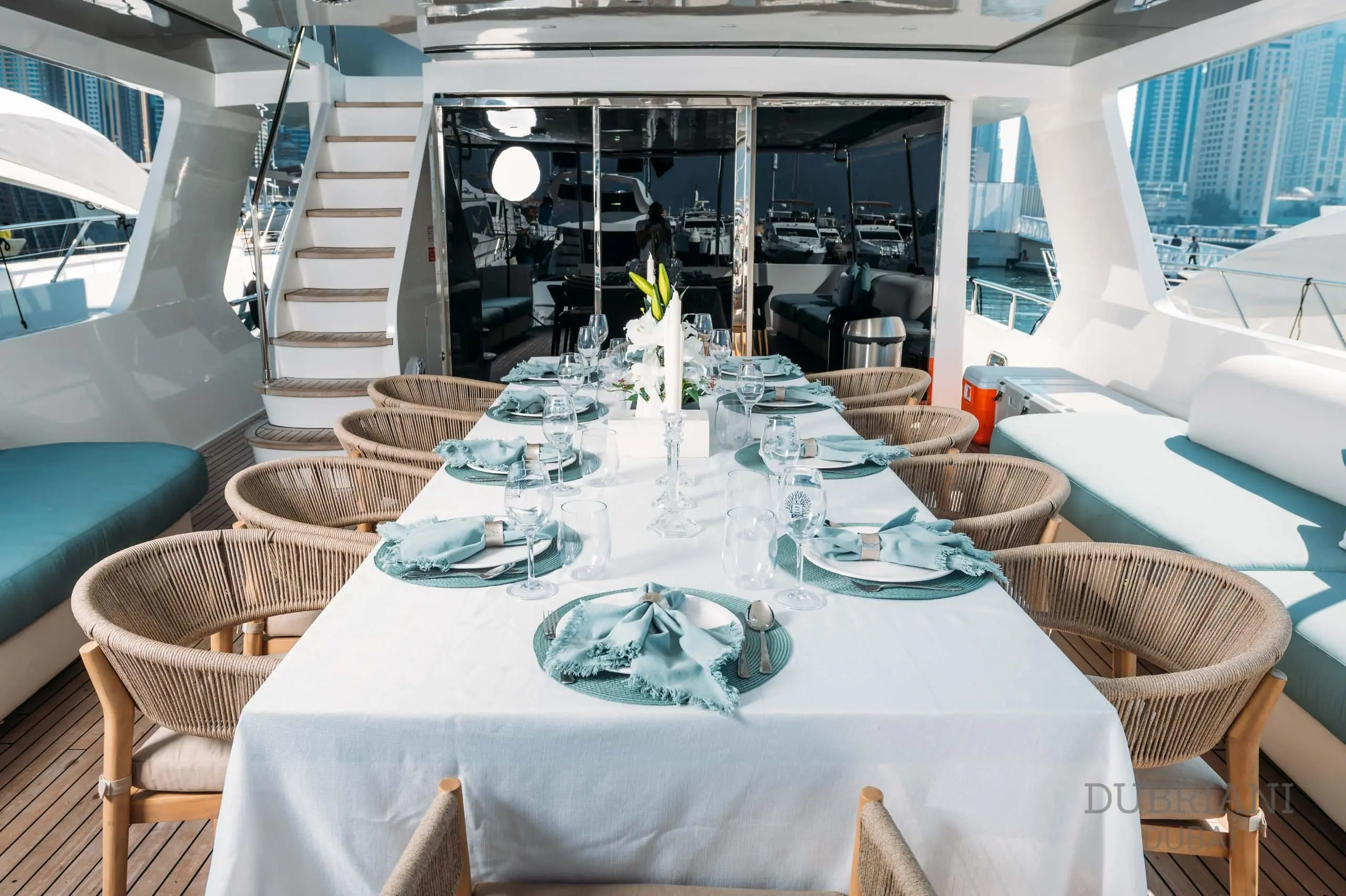 Elegant formal dining table setup aboard Eclipse yacht with luxury place settings and panoramic windows+