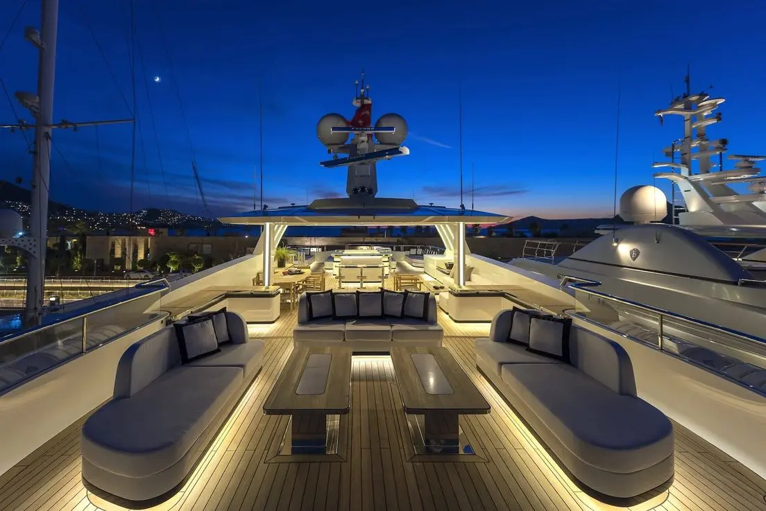 Skyfall 177 yacht illuminated deck at night with luxury seating
