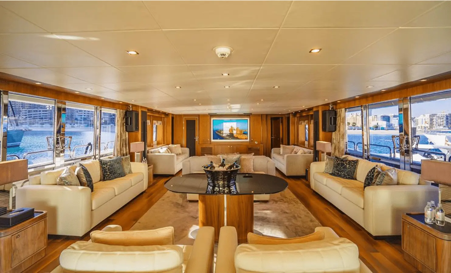 Sunseeker 40M main saloon with cream sofas and champagne bucket