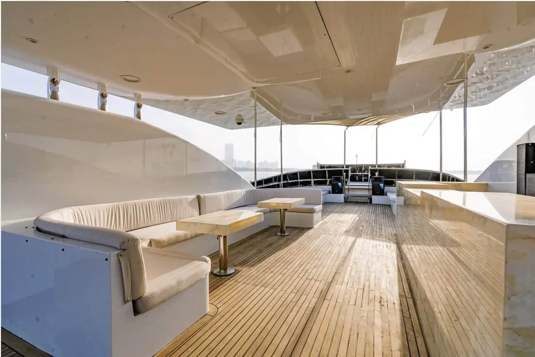 Finesse yacht aft deck pool with sunbeds and open sea backdrop