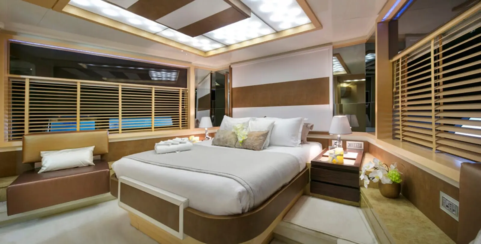 Baia 100 master cabin with skylight and warm wood joinery
