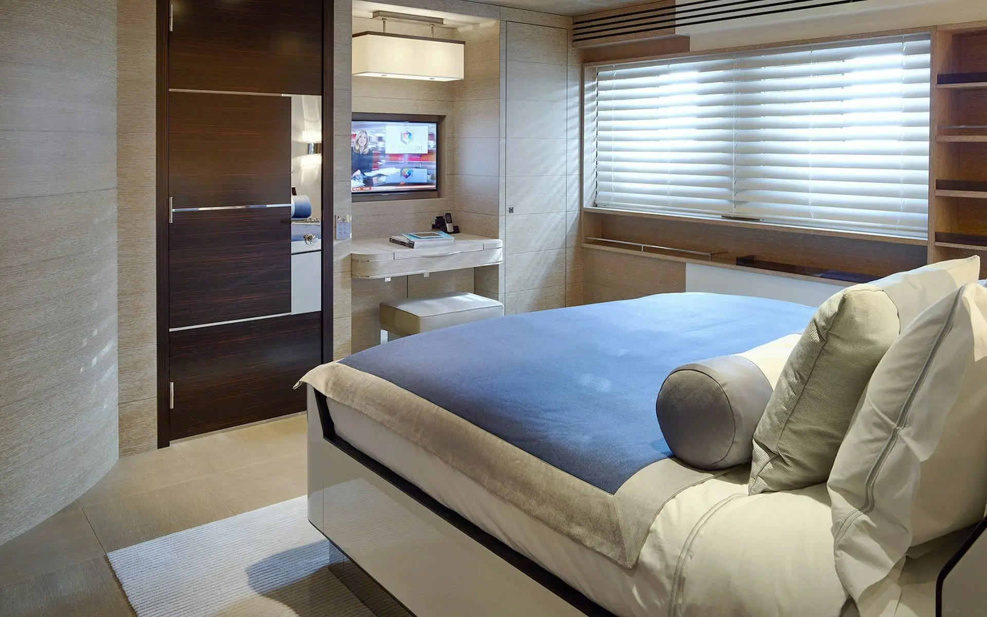 Luxury guest bedroom cabin with blue bedding on Sofiya 153 yacht