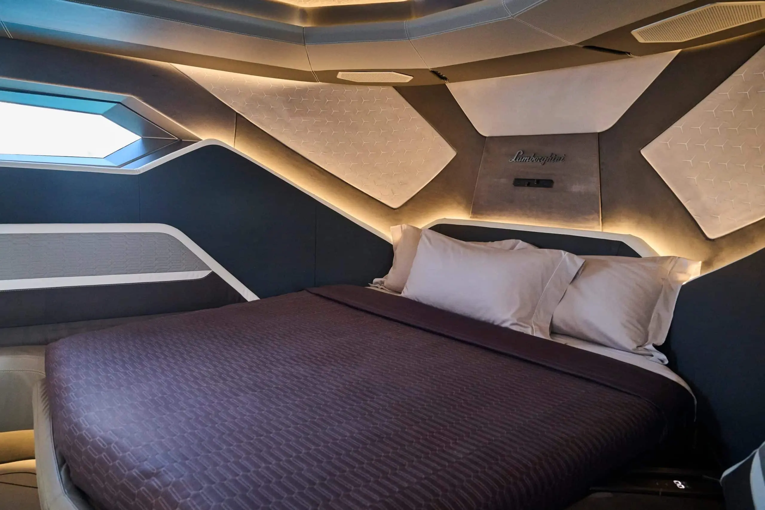 Lamborghini 63 yacht master bedroom with geometric ceiling and luxury bedding
