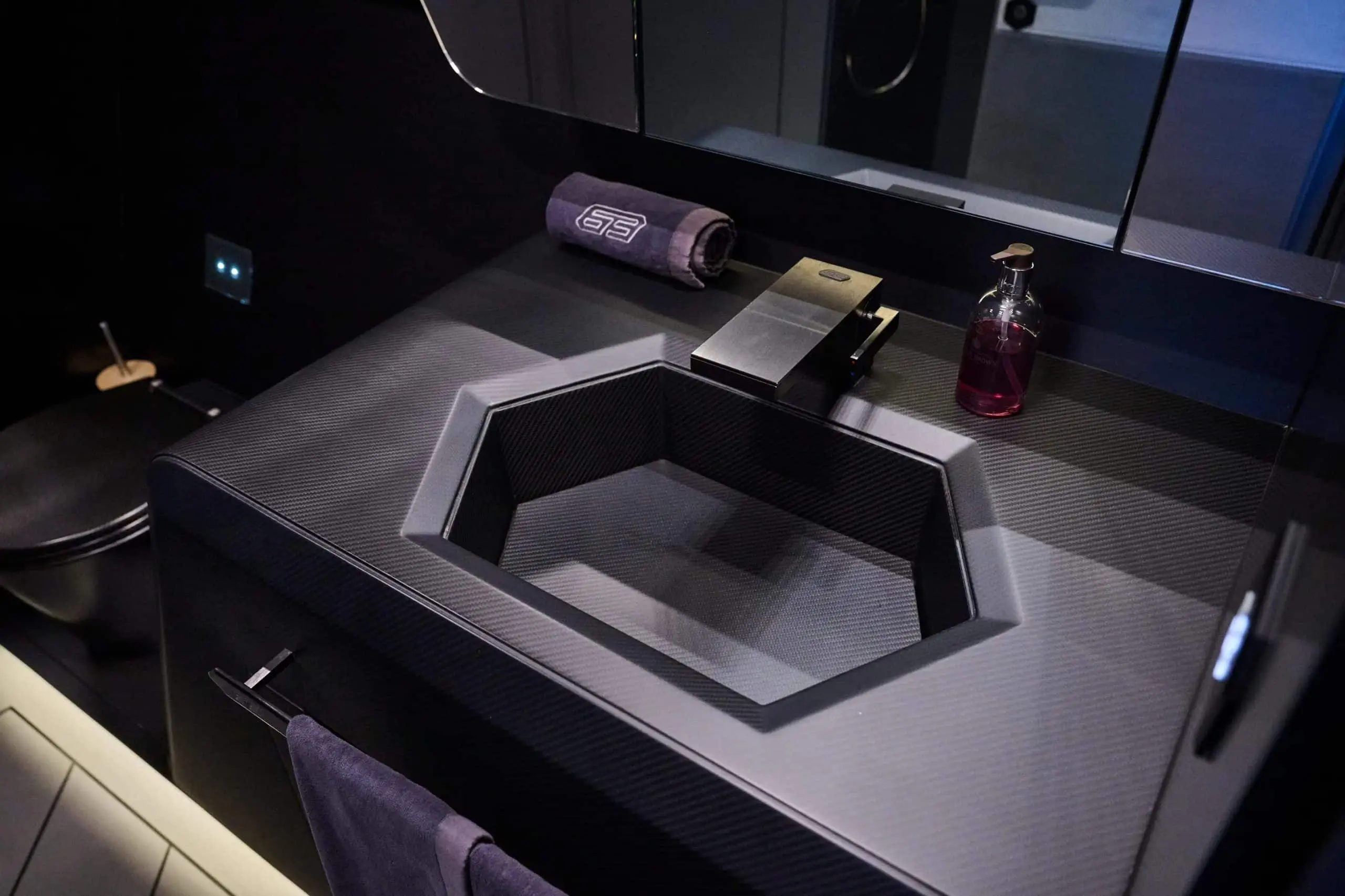 Lamborghini 63 yacht bathroom sink with angular basin and luxury countertop finish