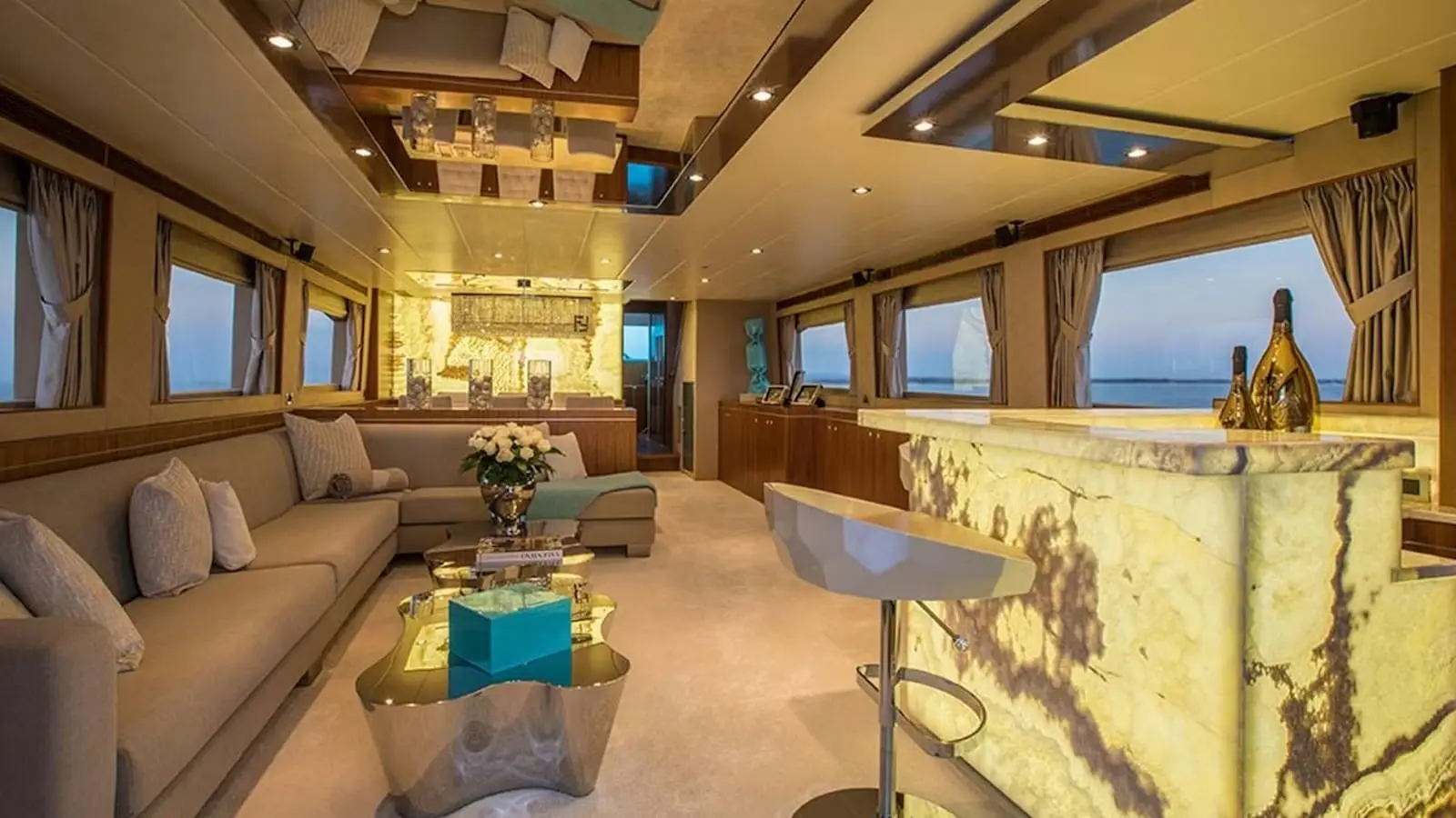 Zeta 100 yacht interior lounge with bar counter and luxury seating