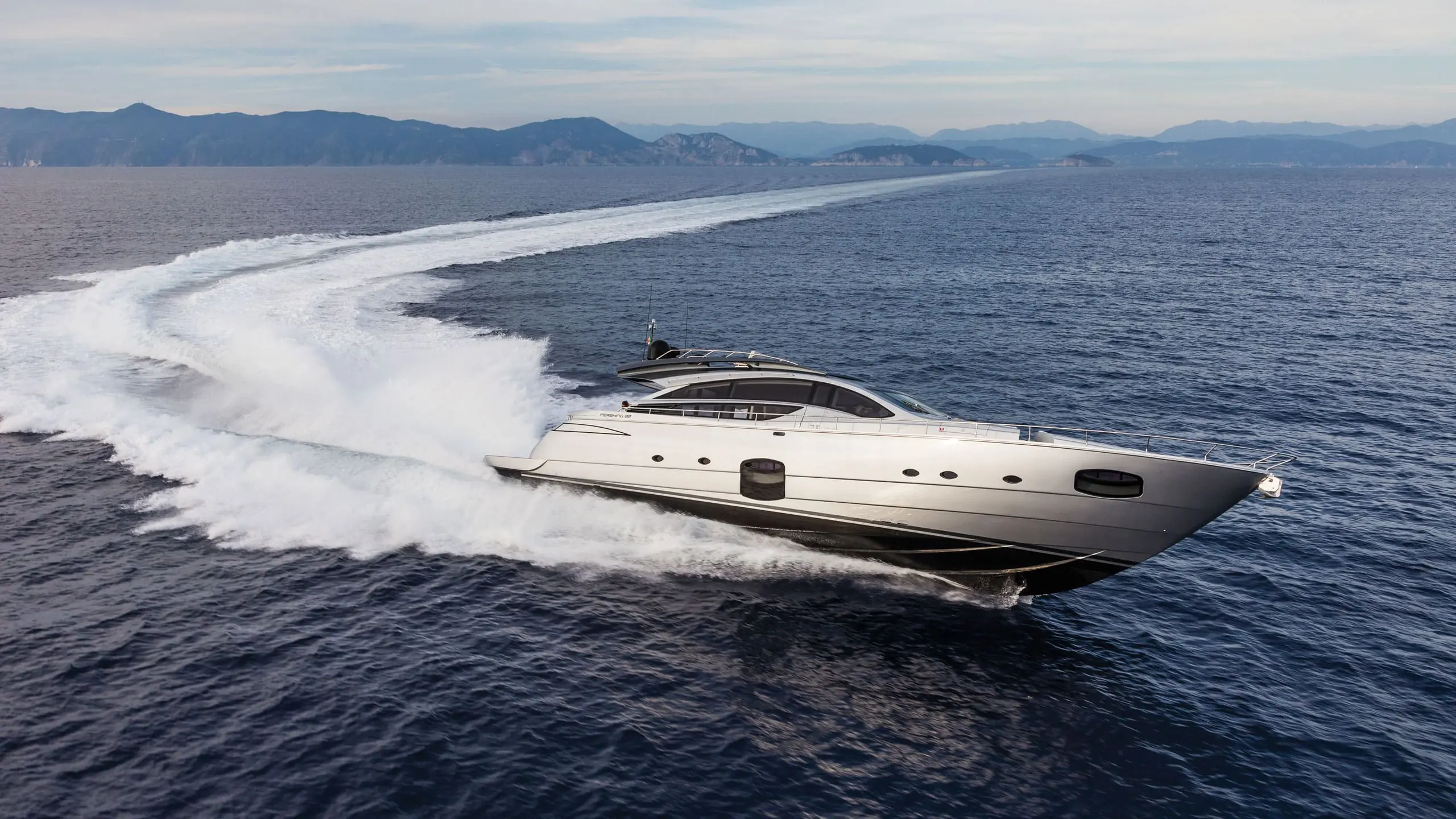 Pershing 82 running at speed offshore, shipyard press photo
