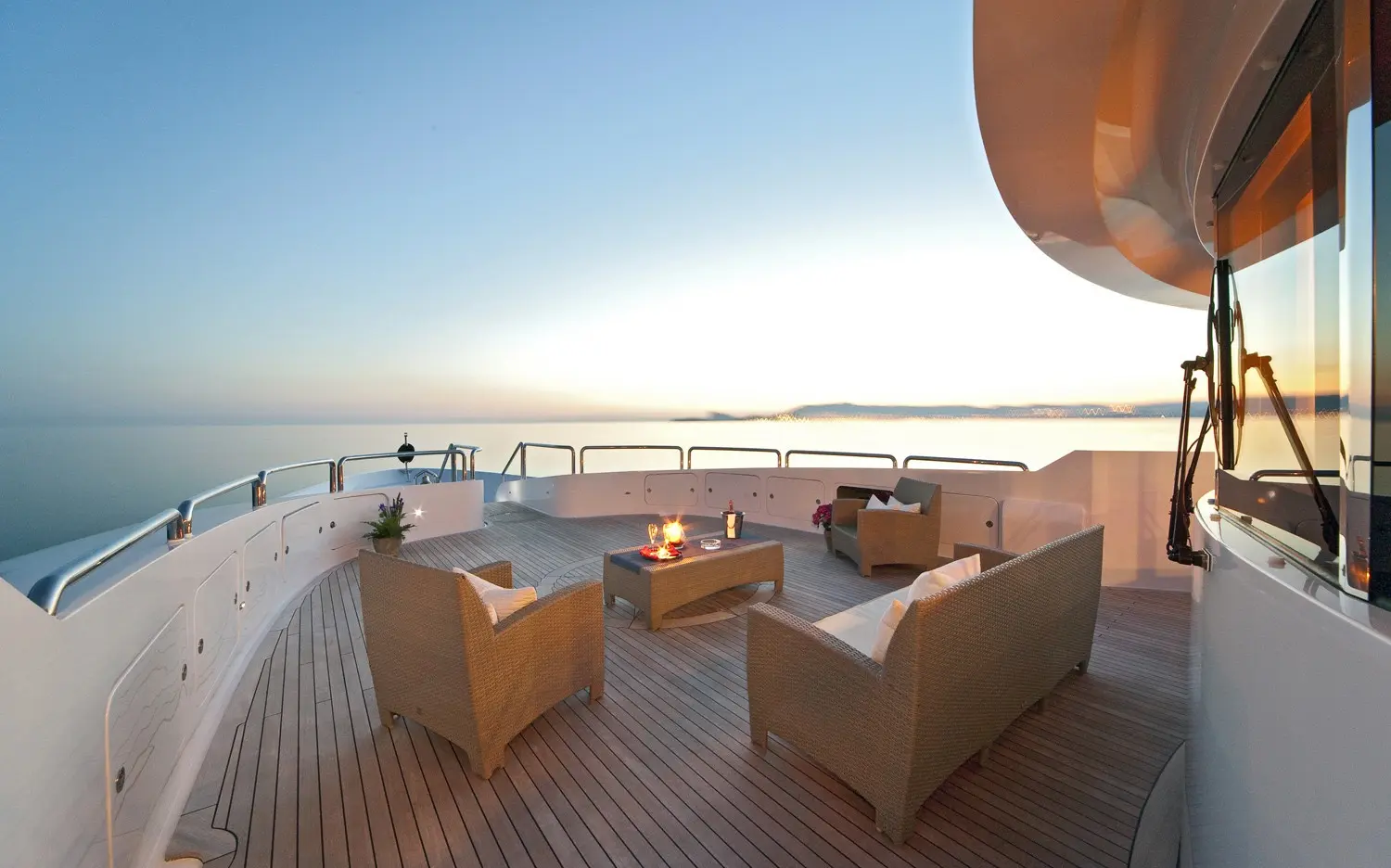 Athena 170 yacht aft deck seating area overlooking the sea