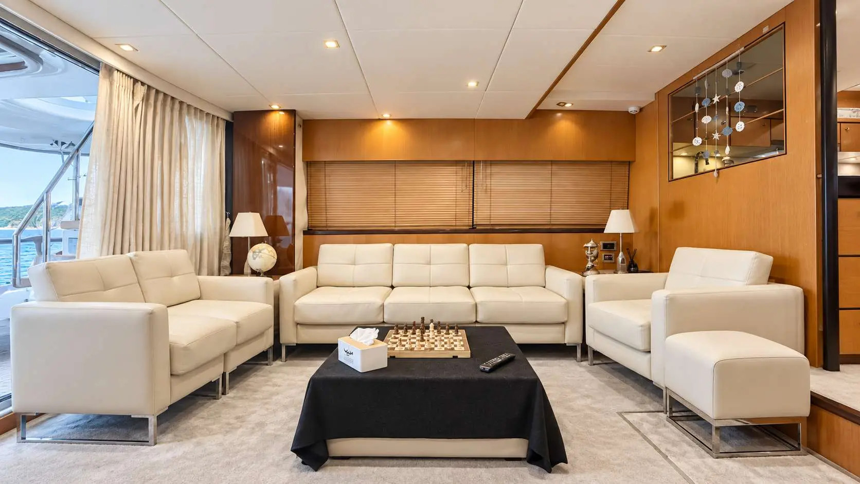 Empress 80 main salon seating area with chessboard