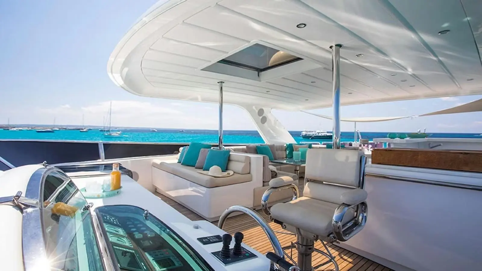 Zeta 100 yacht upper deck lounge seating with shaded canopy