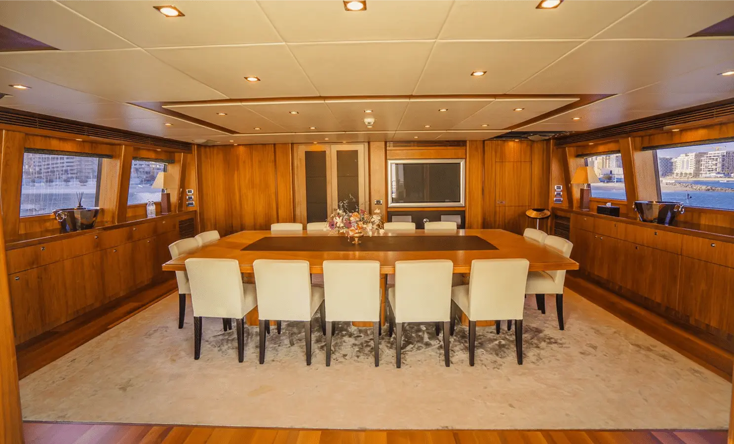 Sunseeker 40M dining saloon with panoramic windows, seats ten