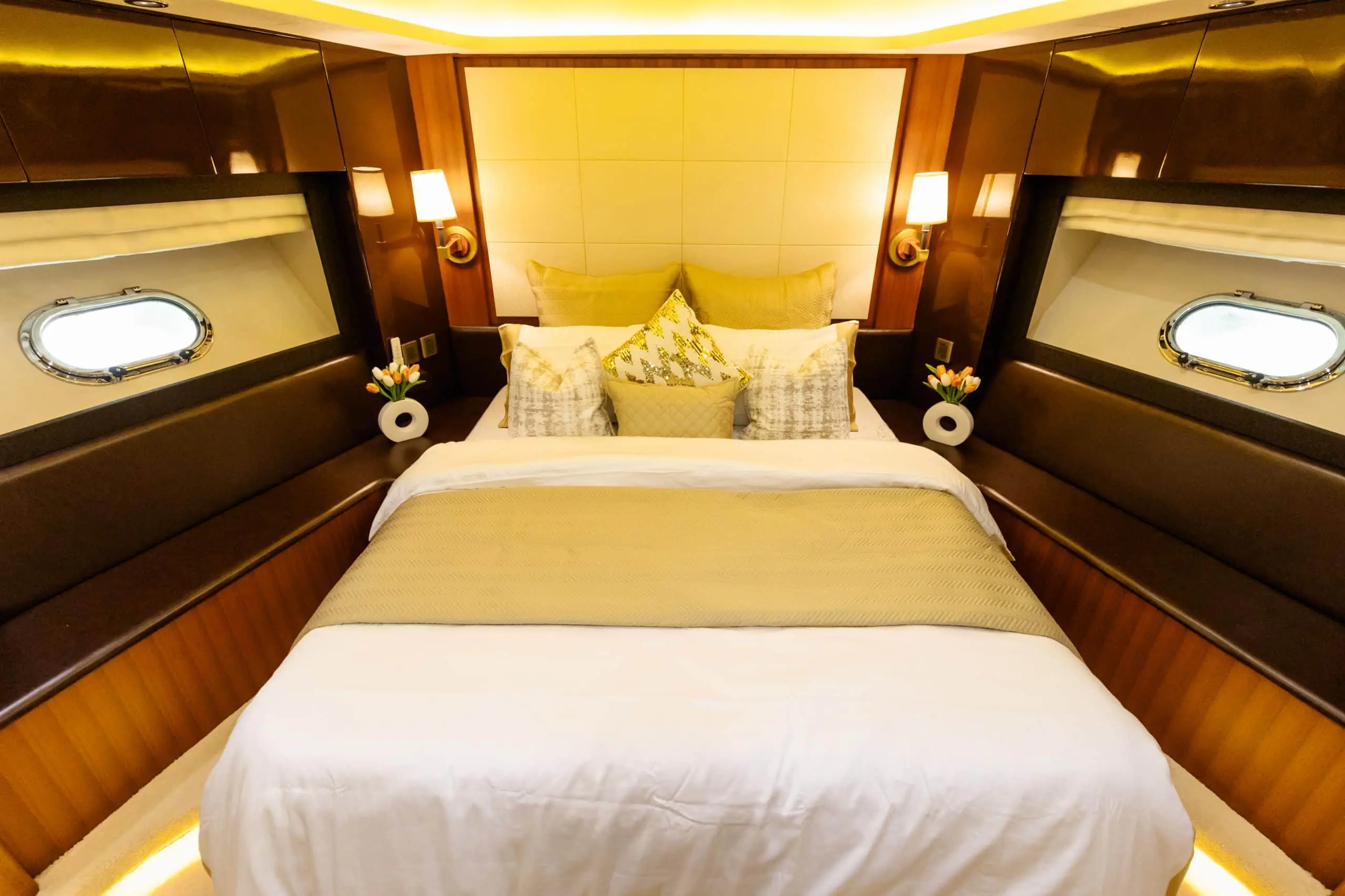 Cante 97 yacht luxury master bedroom with large bed and side tables