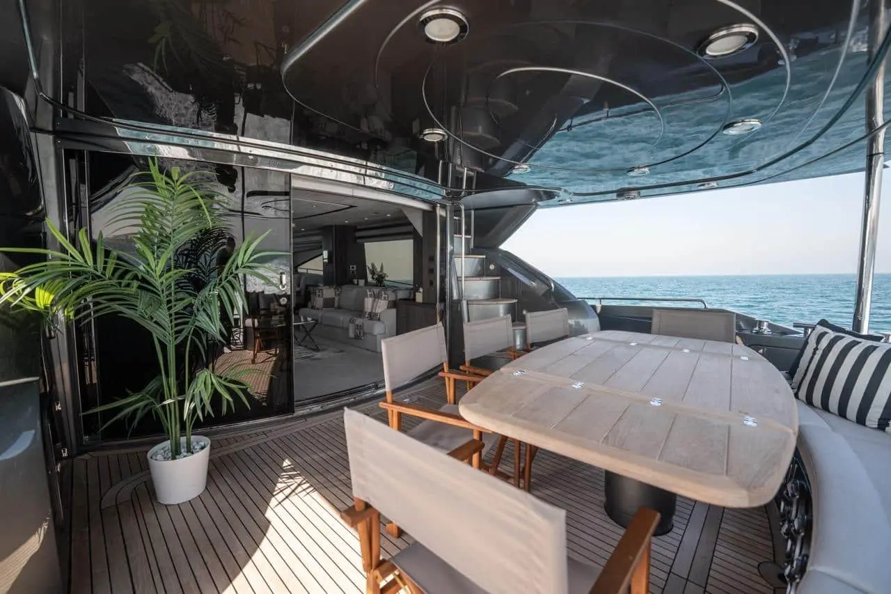 Sunseeker 82 Yacht aft deck dining open to the main saloon