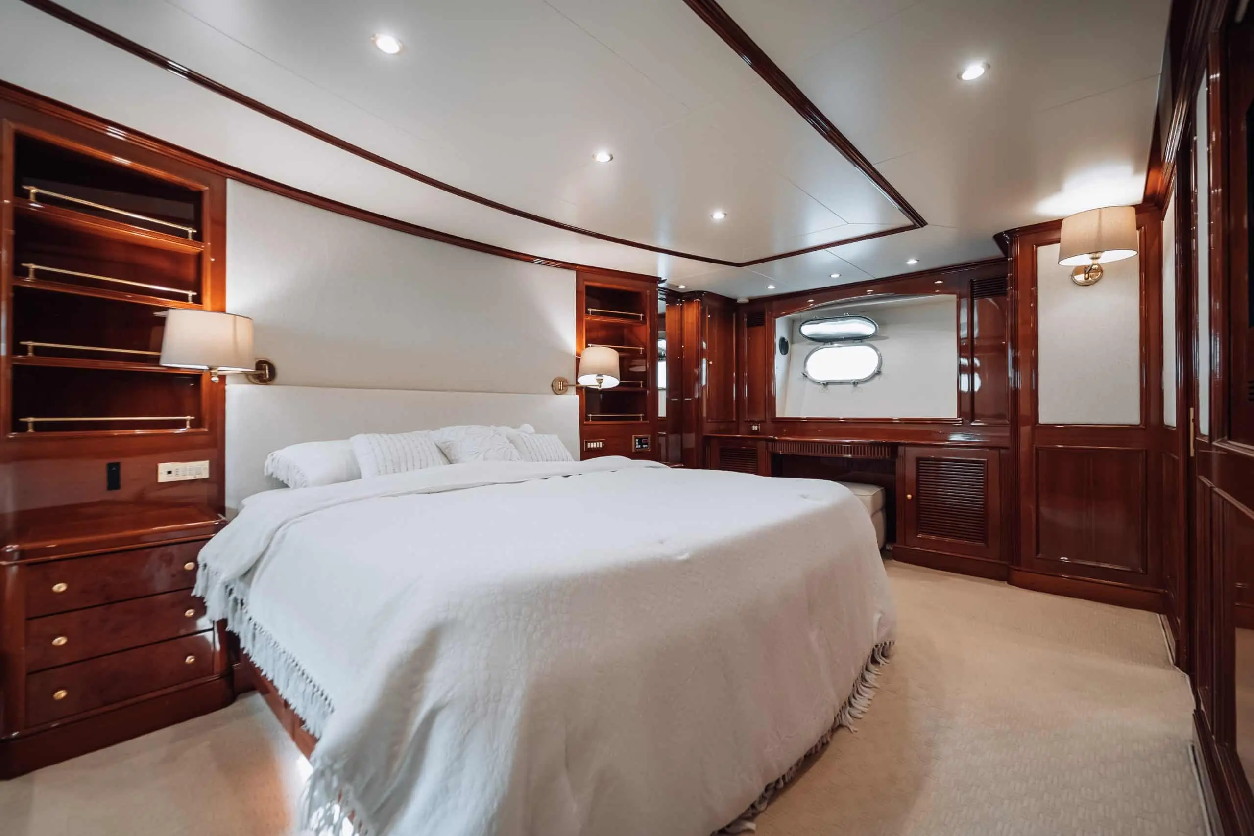 Spacious master bedroom aboard Royal Mirage yacht with luxury furnishings