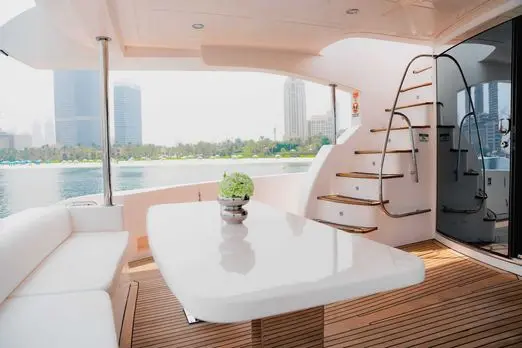 Modern yacht interior with staircase and lounge area on Luna 101 at Yas Marina