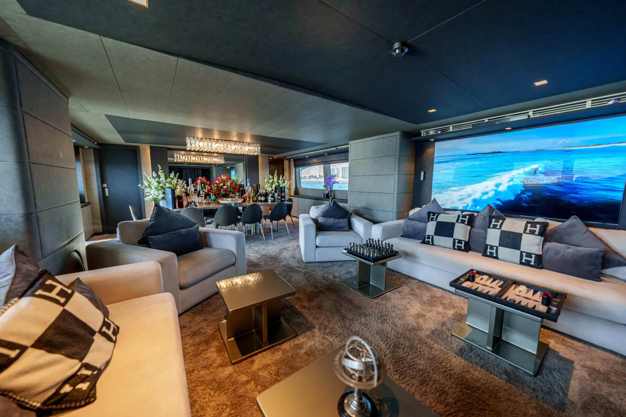 Modern luxury yacht saloon with seating and TV on Tatti 110