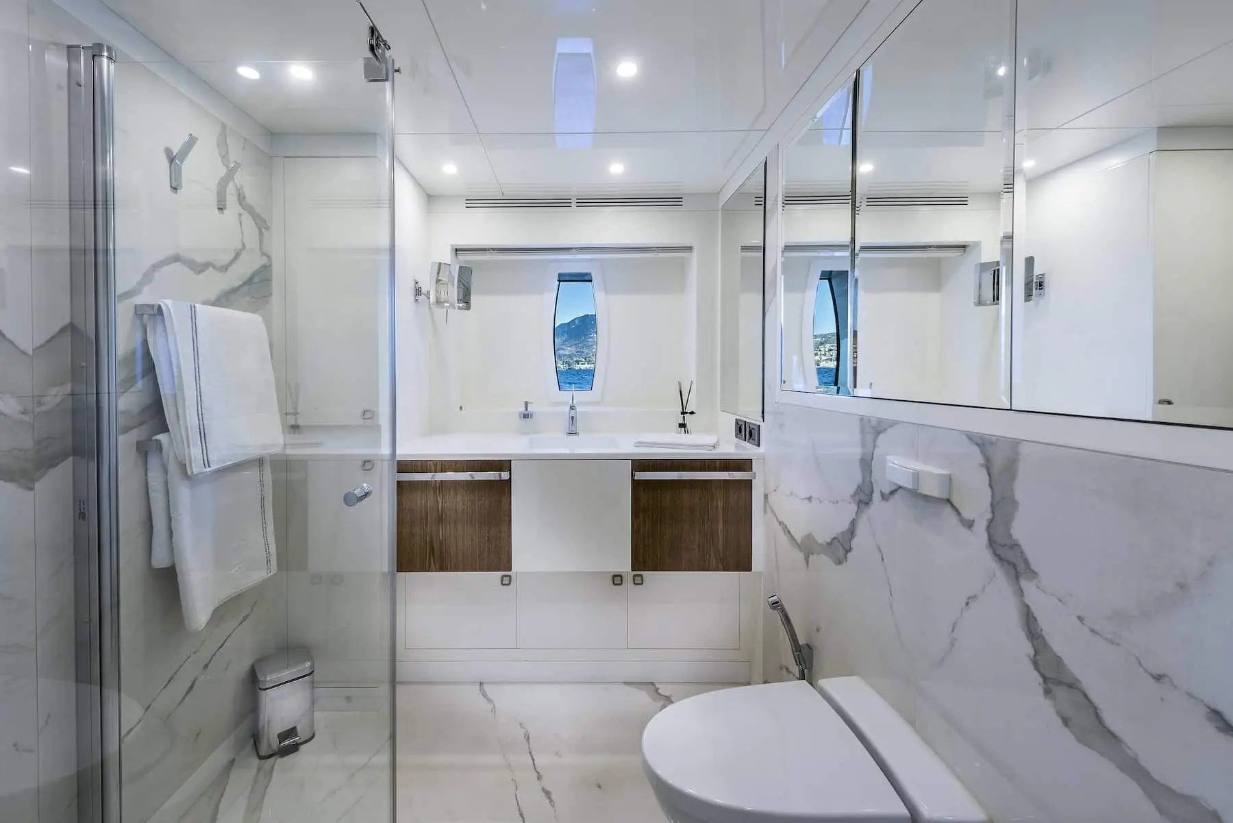 Skyfall 177 yacht guest bathroom with marble walls and modern vanity