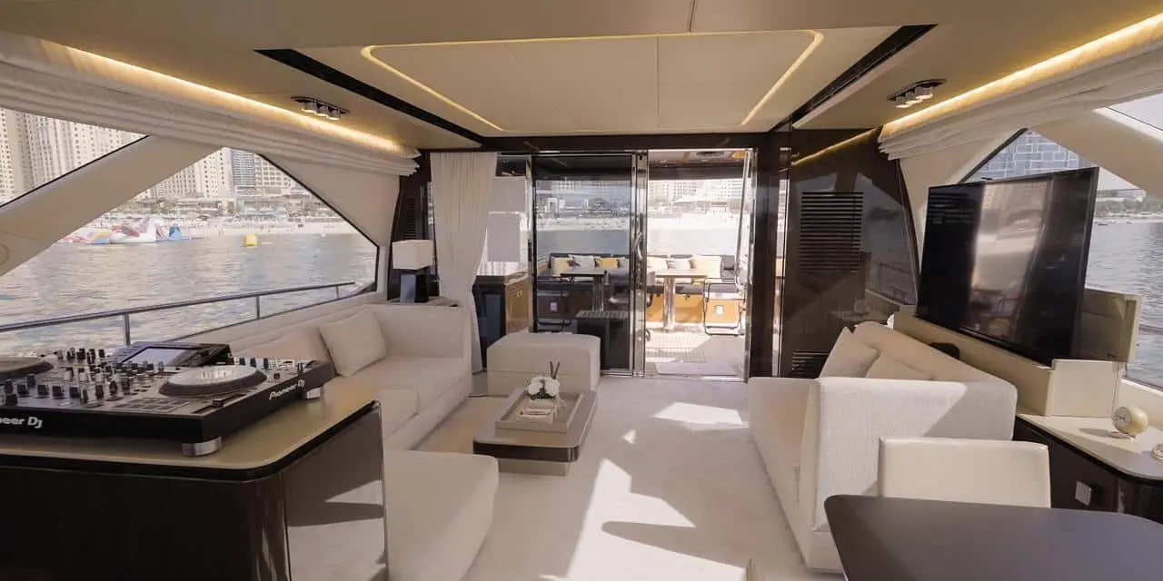 Azimut 77 yacht luxury salon interior with lounge seating, large windows, and entertainment system