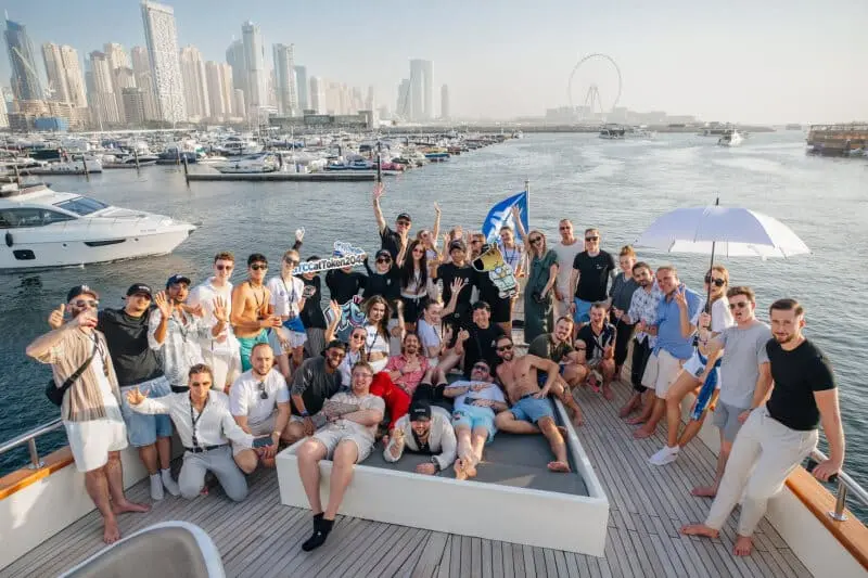 Corporate guests networking on a luxury yacht deck during a Dubai corporate yacht event