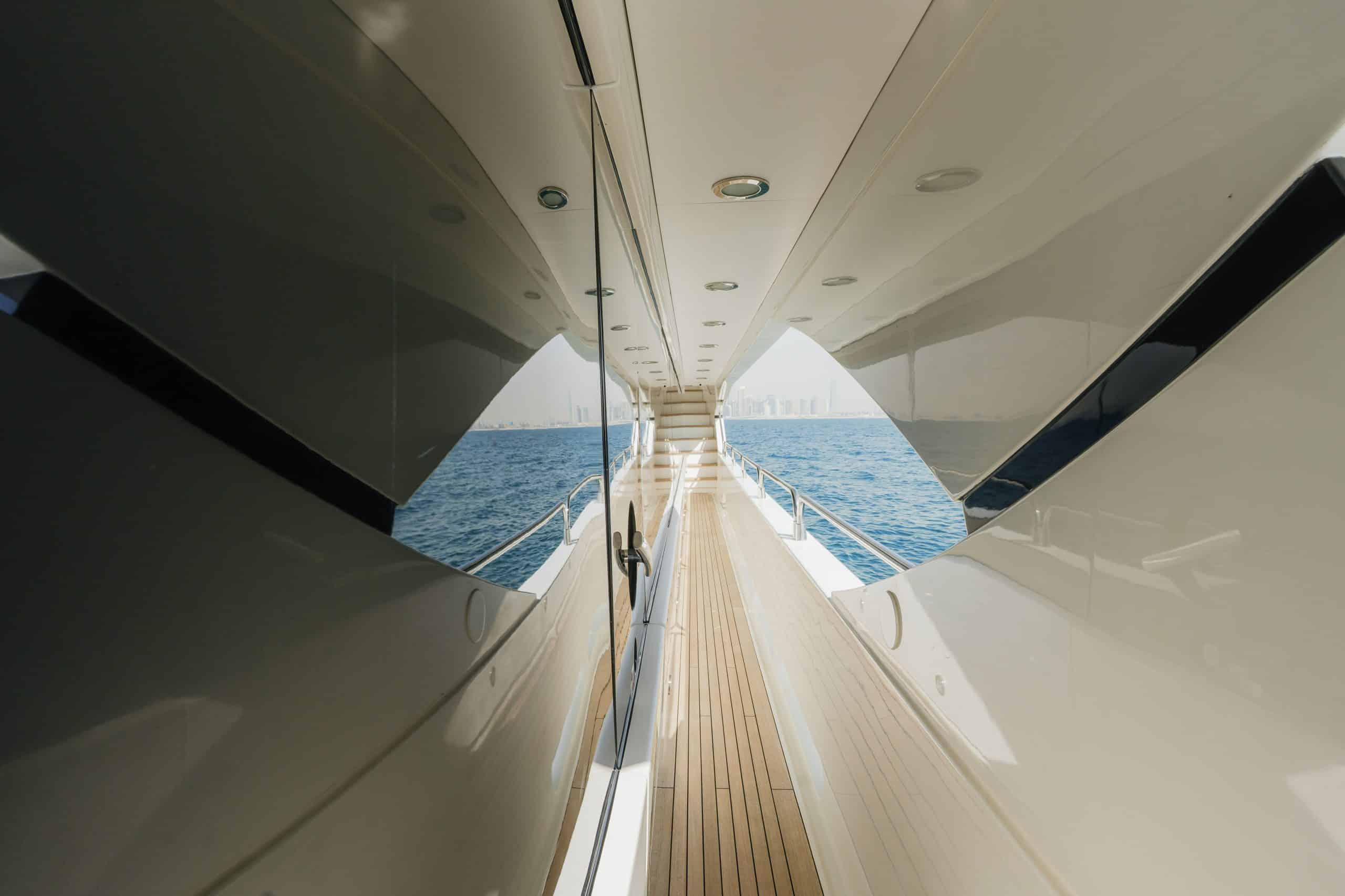 Aurora 130 yacht hallway corridor with polished wood paneling and lighting