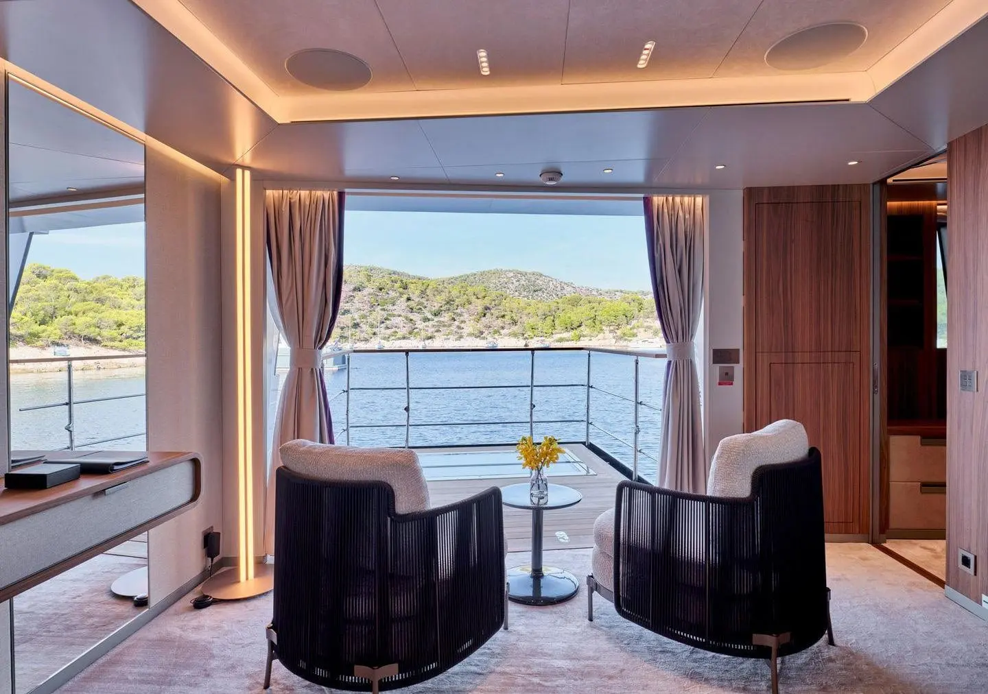 Sanlorenzo 500EXP cabin lounge opening to a terrace, broker photo