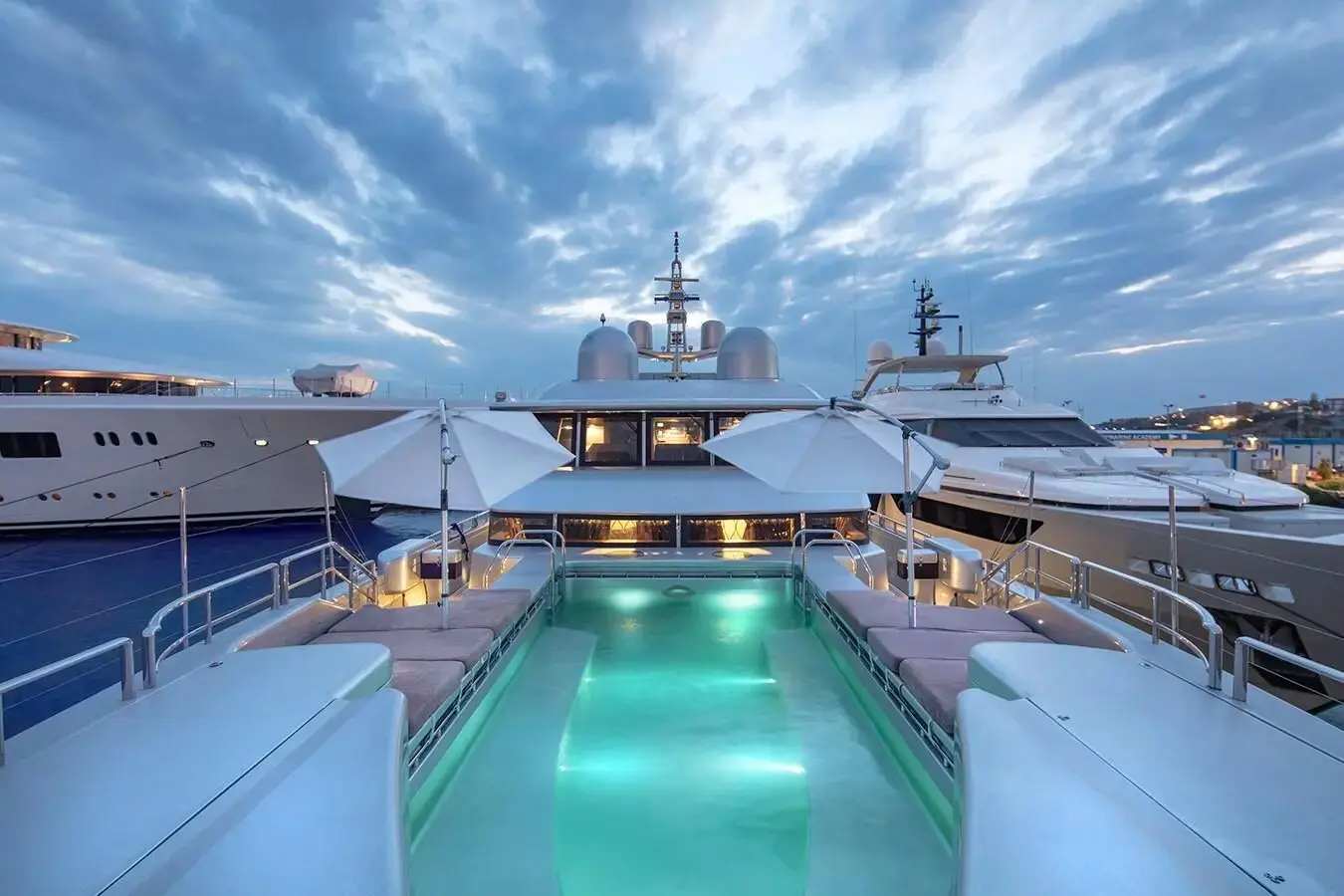 Thunder Superyacht illuminated deck pool at night in Dubai