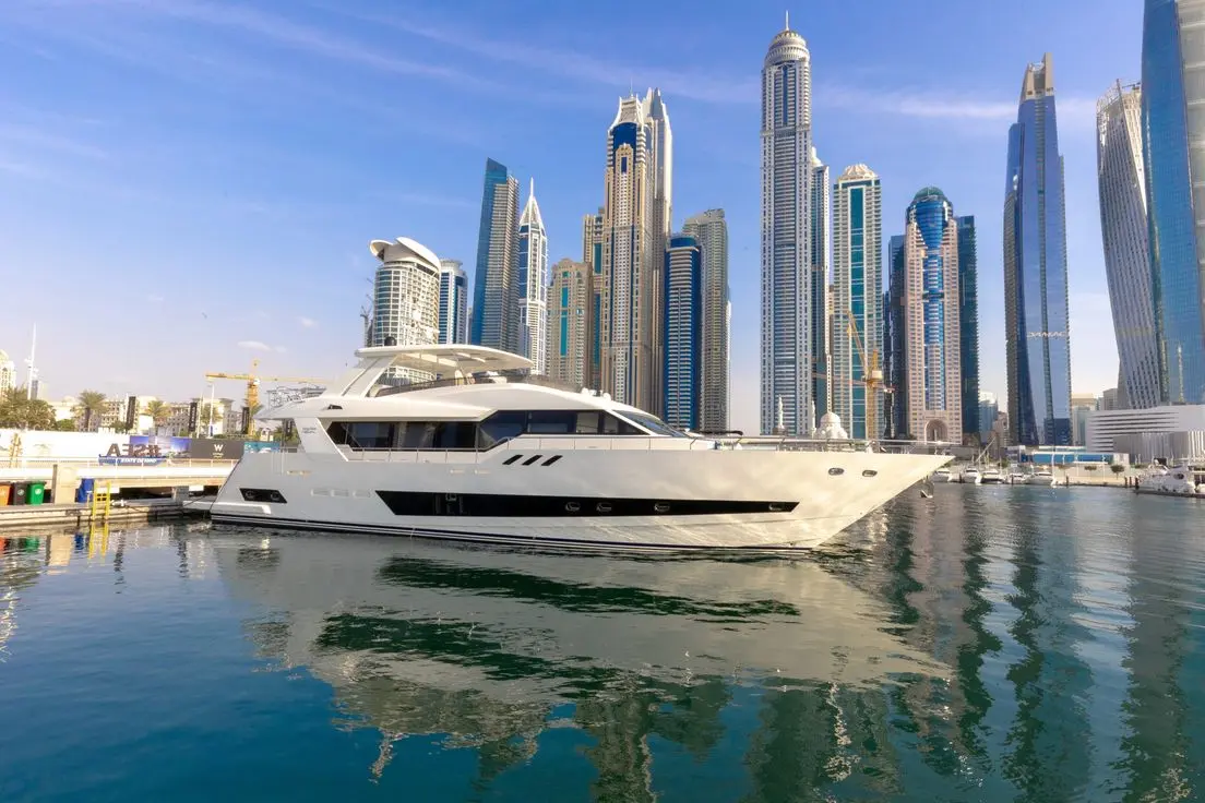 Cante 97 yacht cruising in Dubai Marina with skyline background