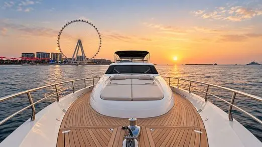 Empress 80 foredeck sunpads facing Ain Dubai at sunset