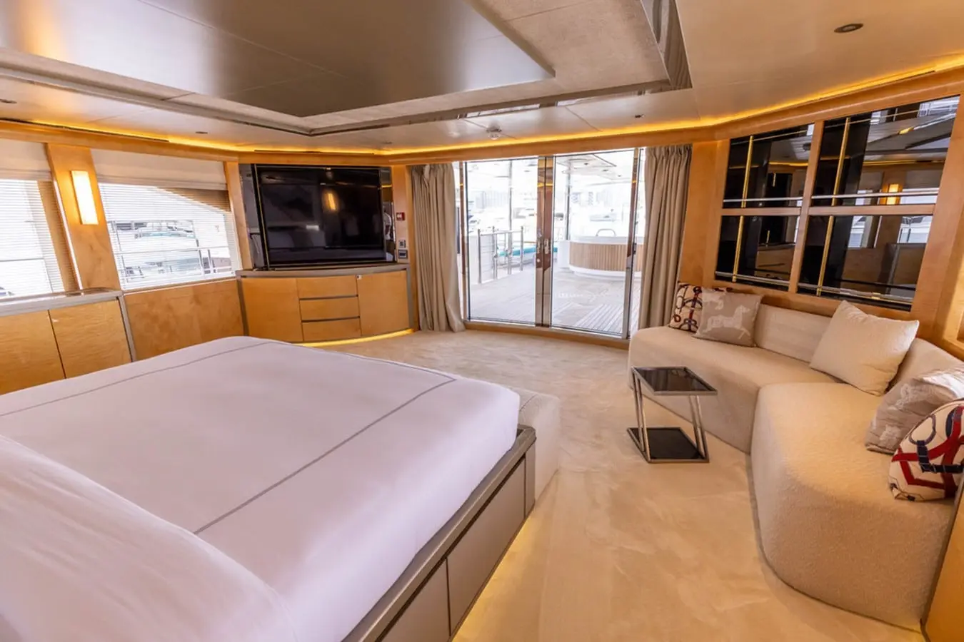 Majesty 155 owner's cabin with lounge and terrace doors, broker photo